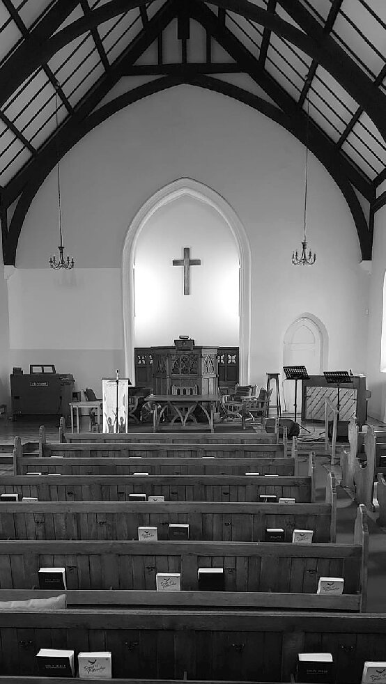 The interior, with its oak pews and carved pulpit